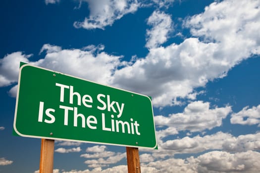 The Sky Is The Limit Green Road Sign with Dramatic Clouds and Sky.