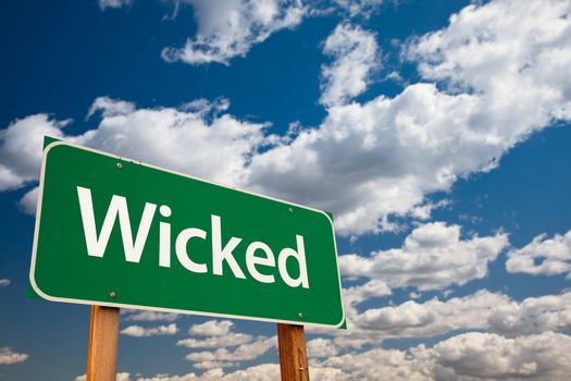 Wicked Green Road Sign with Dramatic Clouds and Sky - The Kudos Sign Series.
