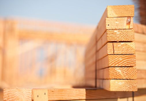 Stack of Building Lumber at Construction Site with Narrow Depth of Field.