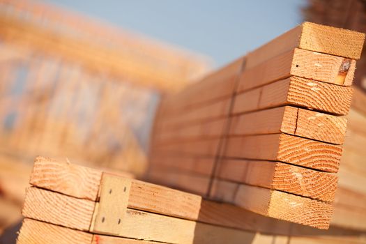 Stack of Building Lumber at Construction Site with Narrow Depth of Field.