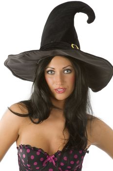 beautiful and sensual brunette with blue eyes and hat of witch on