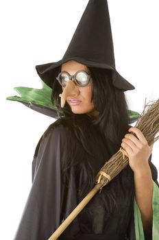 lovely side of a witch with big nose glasses and broom