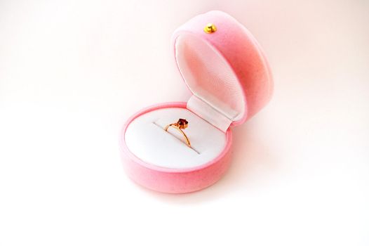 The Golden Ring with a ruby in a box