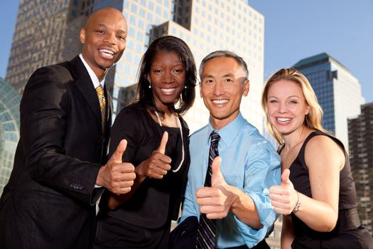 a group of business people giving a thumbs up sign