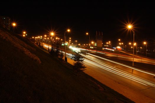 traffic on night roads with street lamps