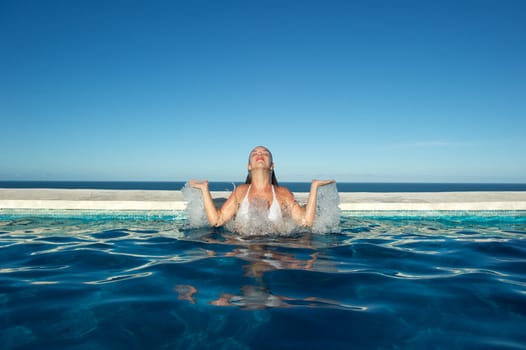 Woman relaxing in the spa swimming pool in Arraial d'Ajuda, Brazil