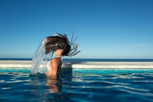 Woman relaxing in the spa swimming pool in Arraial d'Ajuda, Brazil