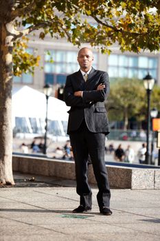 A business man in a city setting outside