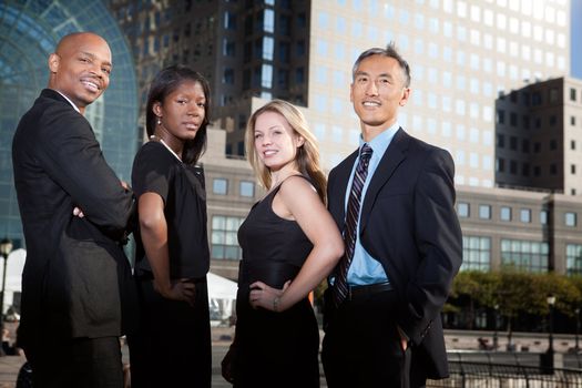 A successful business team in an outdoor setting against a city background