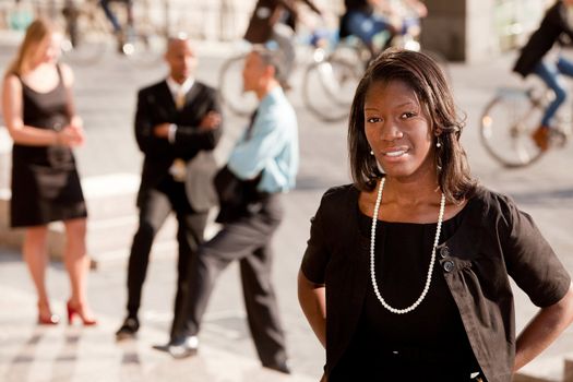 A portrait of an African American business woman outdoors