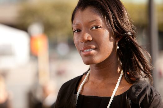 A portrait of an African American business woman outdoors