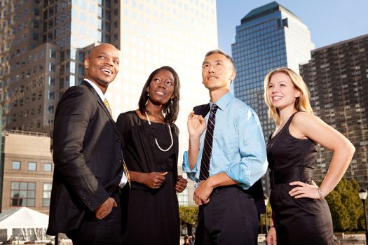 A group of business people looking out of the frame - future concept