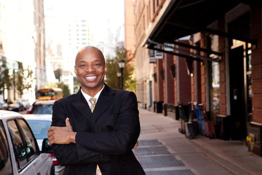 A happy business man on a street in a city