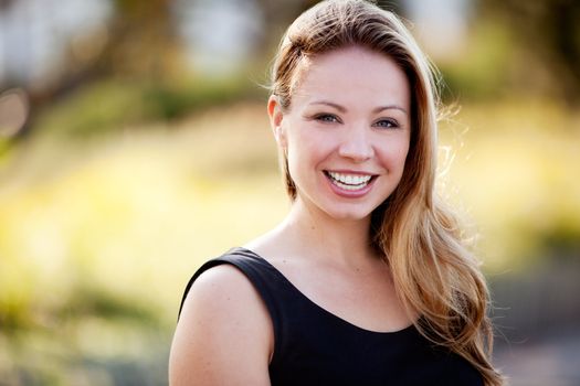 A happy business woman isolated against a difuse background