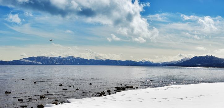 Panoramic image of Lake Tahoe in winter.