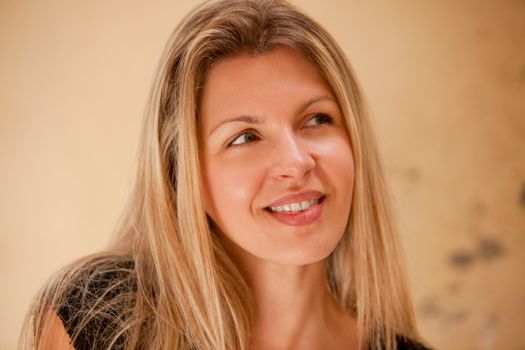 A casual street portrait of a happy attractive european woman