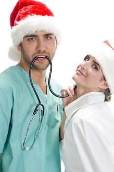 posing medical professionals with stethoscope and santa cap on an isolated white background