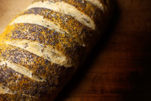 Fresh home-made onion and wild rice bread garnished with poppy seeds with copy space