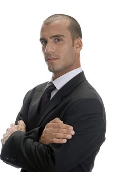 handsome businessman posing with arms crossed and looking to camera