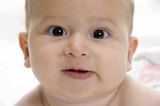 close up view of cute baby with white background