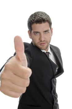 young successful businessman showing thumbs up