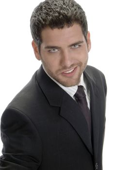smiling businessman looking to camera against white background