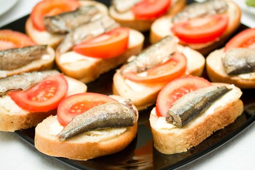 butters with sprat and tomato, on plate