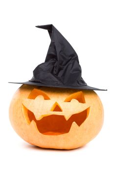 Carved pumpkin in a funny witch hat