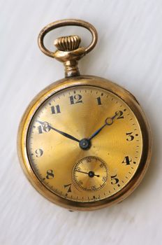 Close up image of an antique gols watch