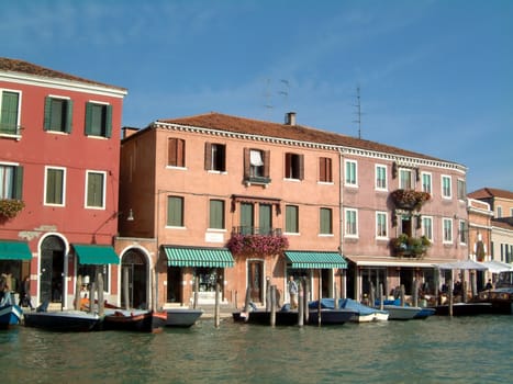 Pretty colourful waterfront shops on Murano, Venice