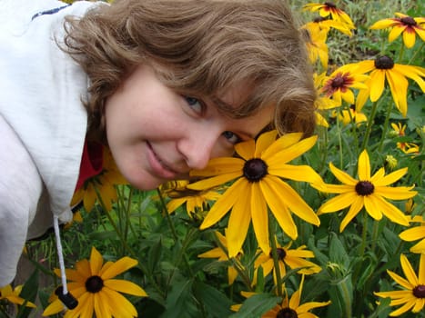 Flowers and the girl , clear day,  grass       