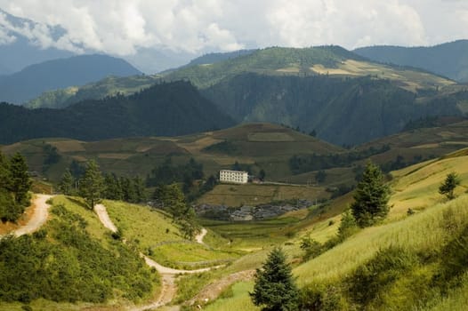 Yunnan province, China. General landscape with high mountains, hills, trees around Shangrila town.