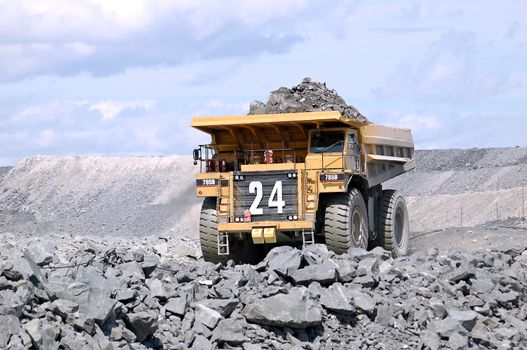 A picture of a big mining truck taken at a gold mine (open pit)