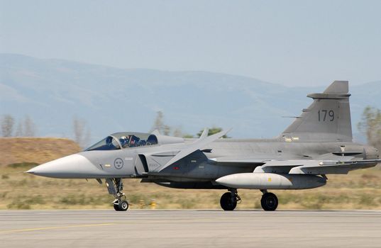 A Swedish Air Force JAS-39 Gripen fighter aircraft arrives in support of the Partnership for Peace Exercise Cooperative Key 2003 at Graf Ignatievo Air Base (AB), Bulgaria (BGR). ** Credit: USAF / yaymicro.com **