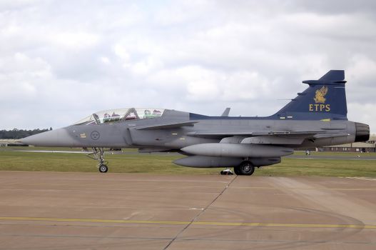 Empire Test Pilot’s School Saab JAS 39B Gripen taxis after landing at the 2008 Royal International Air Tattoo, RAF Fairford, Gloucestershire, England.

The UK Empire Test Pilots’ School (ETPS) operates the Gripen as its advanced fast jet aircraft for training test pilots. ** Credit: Adrian Pingstone / yaymicro.com **

