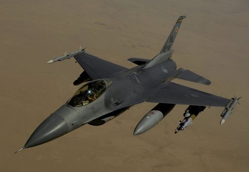 A U.S. Air Force F-16 Fighting Falcon aircraft returns to the fight after receiving fuel from a KC-135 Stratotanker aircraft during a mission over Iraq June 10, 2008. F-16 is assigned to Balad Air Base, Iraq and is deployed from Hill Air Force Base Utah and the KC-135 is assigned to the 340th Expeditionary Air Refueling Squadron, 379th Air Expeditionary Wing, Southwest Asia and is deployed from the 906th Air Refueling Squadron, 319th Air Refueling Wing, Grand Forks N.D. ** Credit:  Master Sgt. Andy Dunaway / USAF / yaymicro.com **