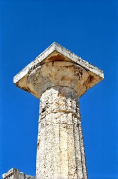 Doric order column against blue sky