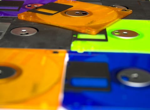 Background consisting of several diskettes of different color. Shallow DOF