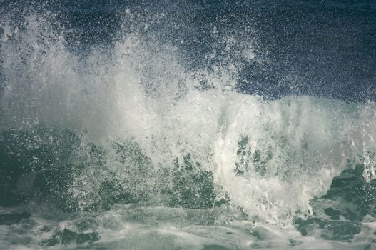 Dramatic Shorebreak Wave on a clear morning.