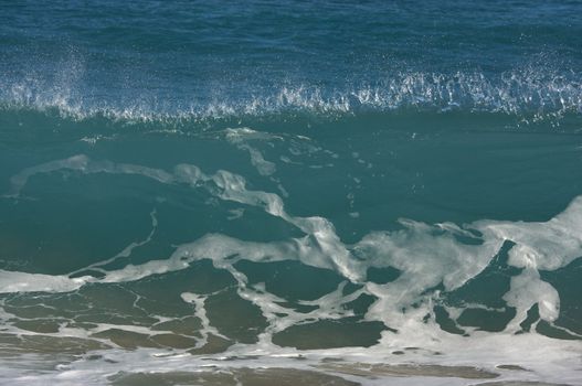 Dramatic Shorebreak Wave on a clear morning.