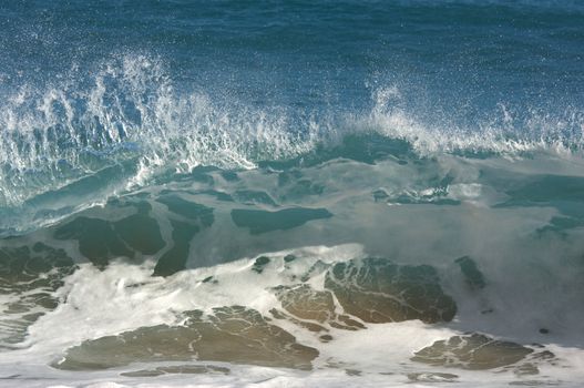 Dramatic Shorebreak Wave on a clear morning.