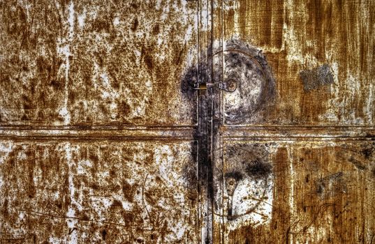Rusty metallic door background with one lock.