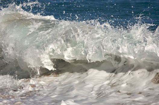 Dramatic Shorebreak Wave on a clear morning.