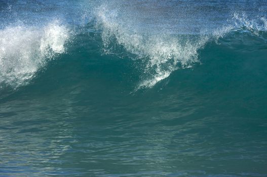 Dramatic Shorebreak Wave on a clear morning.