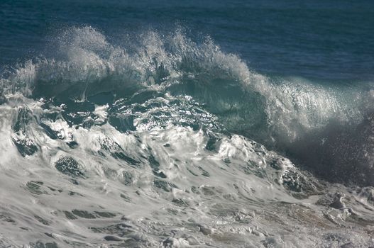 Dramatic Shorebreak Wave on a clear morning.