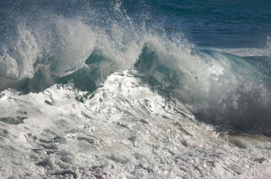 Dramatic Shorebreak Wave on a clear morning.