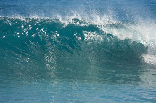 Dramatic Shorebreak Wave on a clear morning.
