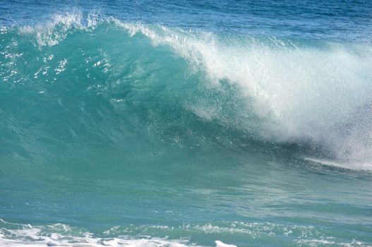 Dramatic Shorebreak Wave on a clear morning.