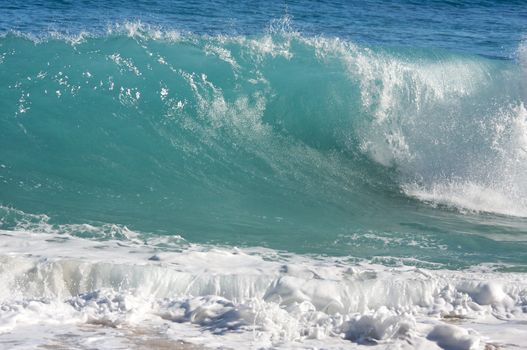 Dramatic Shorebreak Wave on a clear morning.