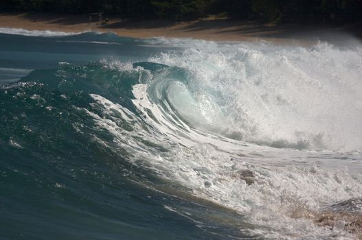 Dramatic Shorebreak Wave on a clear morning.
